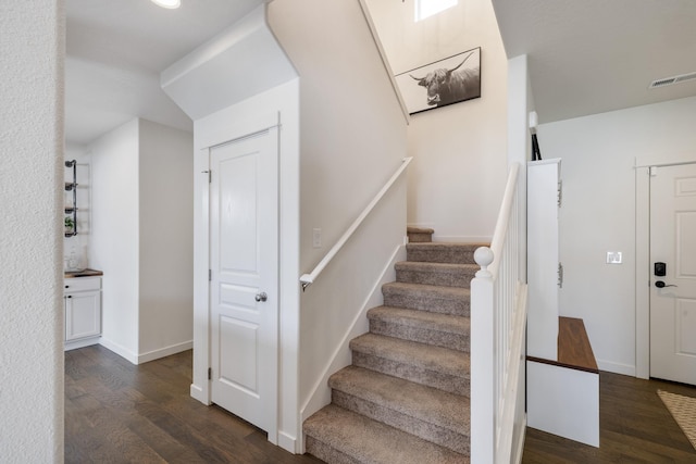 1024 W Staples Rd, Post Falls, ID 83854 - stairs featuring wood finished floors and baseboards