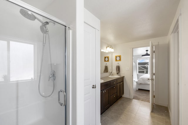 1024 W Staples Rd, Post Falls, ID 83854 - ensuite bathroom featuring a stall shower, double vanity, and tile patterned floors