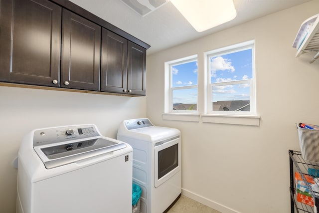 1024 W Staples Rd, Post Falls, ID 83854 - laundry room featuring washer and dryer and cabinet space