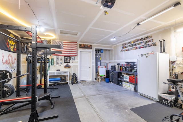 1024 W Staples Rd, Post Falls, ID 83854 - garage with freestanding refrigerator and a garage door opener