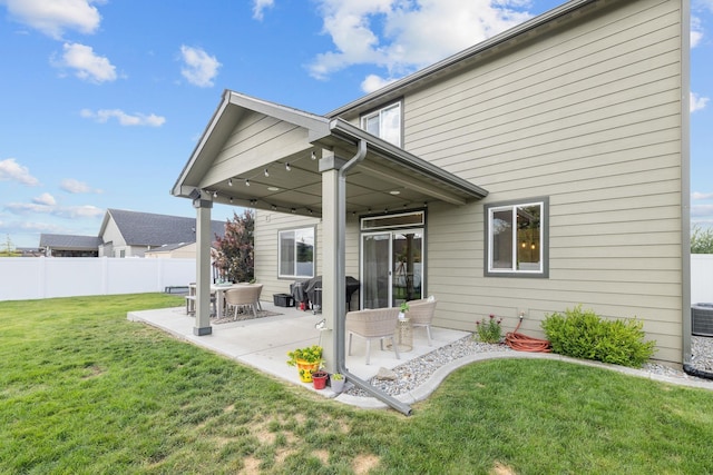 1024 W Staples Rd, Post Falls, ID 83854 - back of property with a patio