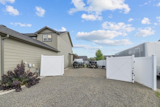 1024 W Staples Rd, Post Falls, ID 83854 - view of property exterior with a gate and driveway