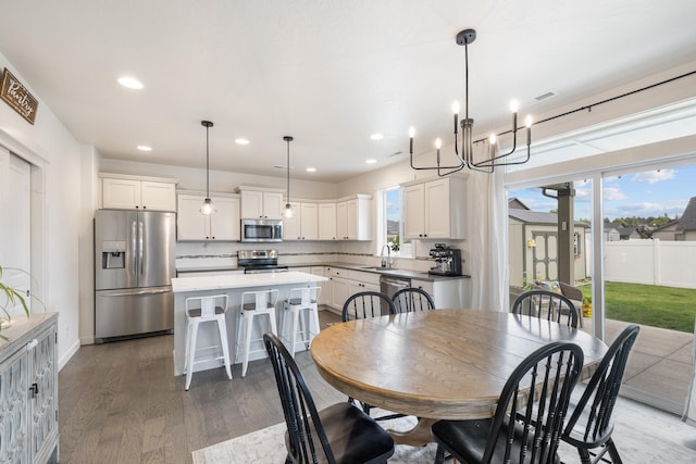 1024 W Staples Rd, Post Falls, ID 83854 - dining room with light wood finished floors, recessed lighting, and a chandelier