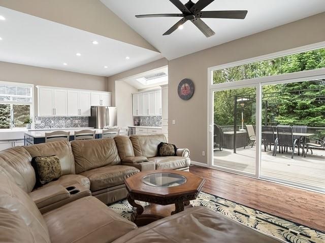4332 S Greystone Ln, Spokane, WA 99223 - living area featuring wood finished floors, recessed lighting, ceiling fan, and lofted ceiling