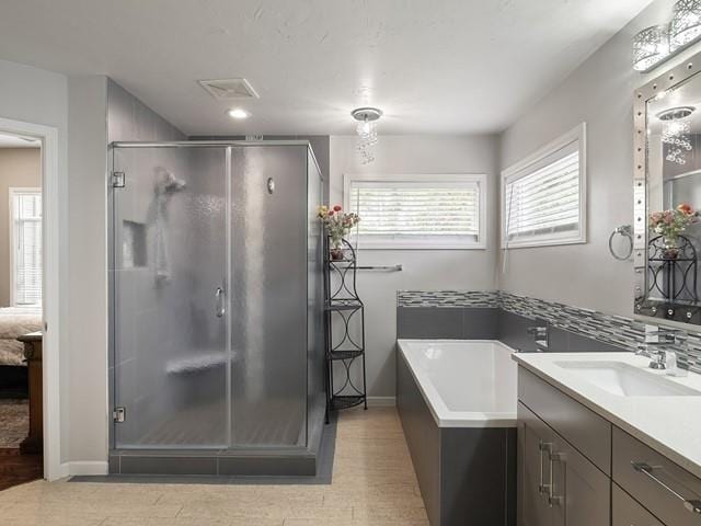 4332 S Greystone Ln, Spokane, WA 99223 - full bath featuring vanity, a shower stall, a garden tub, and connected bathroom