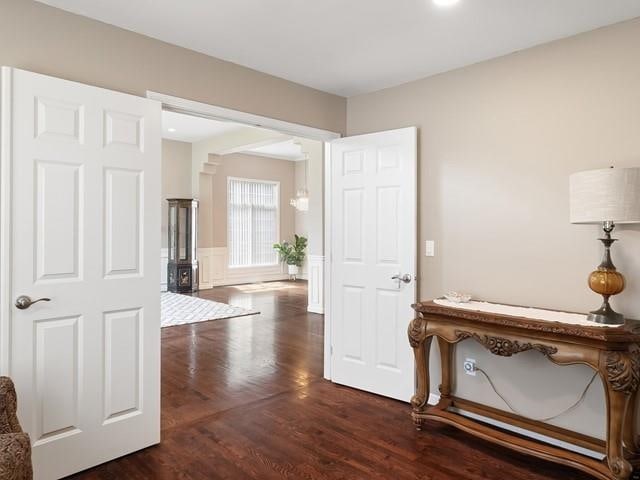 4332 S Greystone Ln, Spokane, WA 99223 - hall with dark wood-style flooring, wainscoting, and ornate columns