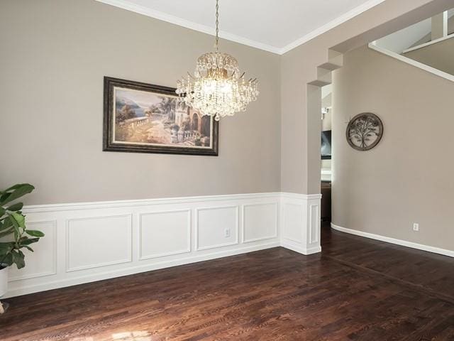 4332 S Greystone Ln, Spokane, WA 99223 - unfurnished dining area with a chandelier, dark wood finished floors, crown molding, a wainscoted wall, and a decorative wall