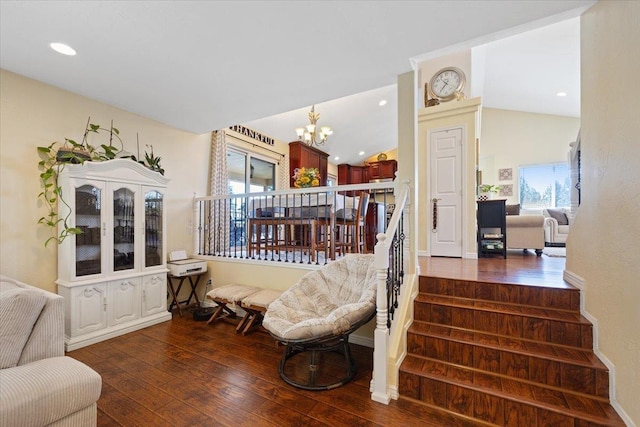 5808 N Hermosa Cir, Otis Orchards, WA 99027 - living area featuring a chandelier, dark wood-type flooring, plenty of natural light, stairway, and vaulted ceiling