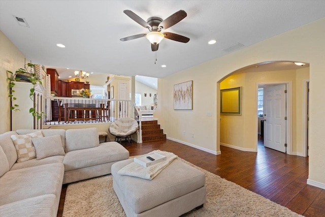 5808 N Hermosa Cir, Otis Orchards, WA 99027 - living area with arched walkways, dark wood-type flooring, ceiling fan, a chandelier, and recessed lighting