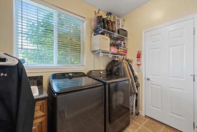 5808 N Hermosa Cir, Otis Orchards, WA 99027 - laundry area with separate washer and dryer, light tile patterned floors, and cabinet space