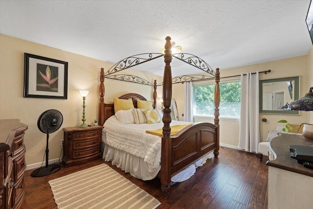 5808 N Hermosa Cir, Otis Orchards, WA 99027 - bedroom featuring dark wood-style floors and a textured ceiling