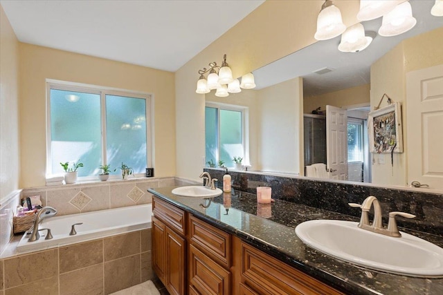5808 N Hermosa Cir, Otis Orchards, WA 99027 - bathroom featuring double vanity, a bath, a shower stall, and healthy amount of natural light