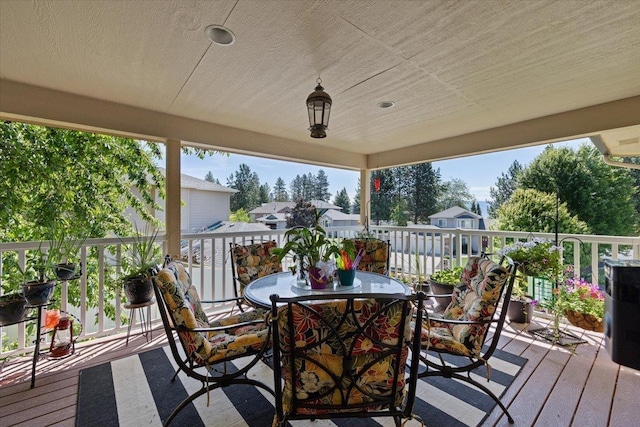 5808 N Hermosa Cir, Otis Orchards, WA 99027 - wooden terrace with outdoor dining space