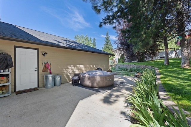 5808 N Hermosa Cir, Otis Orchards, WA 99027 - view of side of home with a patio area, a yard, and roof with shingles