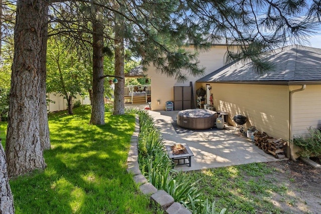 5808 N Hermosa Cir, Otis Orchards, WA 99027 - view of grassy yard with a fire pit, a patio area, and a wooden deck