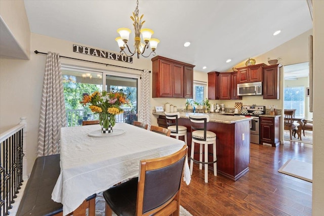 5808 N Hermosa Cir, Otis Orchards, WA 99027 - dining area with dark wood-style flooring, a chandelier, healthy amount of natural light, lofted ceiling, and recessed lighting