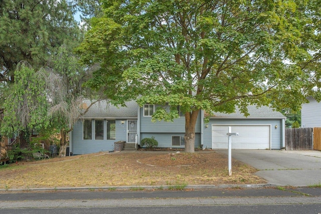 415 E Shiloh Hills Dr, Spokane, WA 99208 - tri-level home with driveway, a garage, entry steps, and a shingled roof