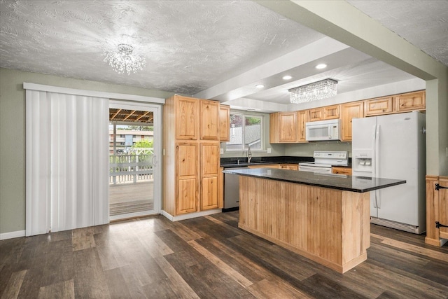 415 E Shiloh Hills Dr, Spokane, WA 99208 - kitchen featuring white appliances, dark wood-type flooring, recessed lighting, a center island, and dark countertops