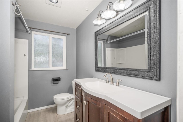415 E Shiloh Hills Dr, Spokane, WA 99208 - bathroom with wood finished floors, vanity, and bathing tub / shower combination