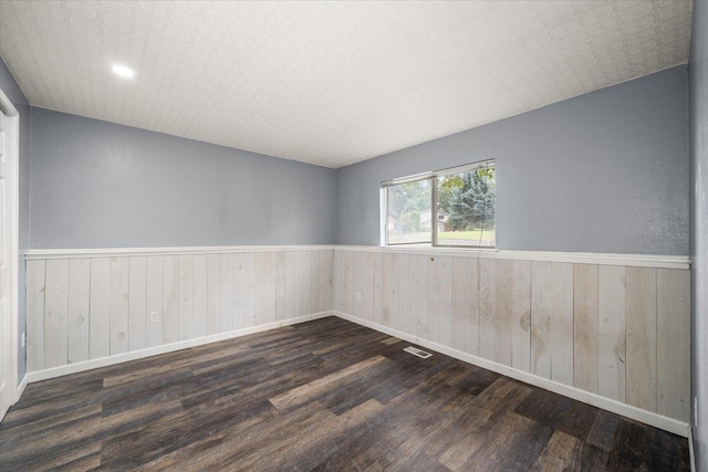 415 E Shiloh Hills Dr, Spokane, WA 99208 - spare room featuring wood finished floors, a wainscoted wall, and wood walls