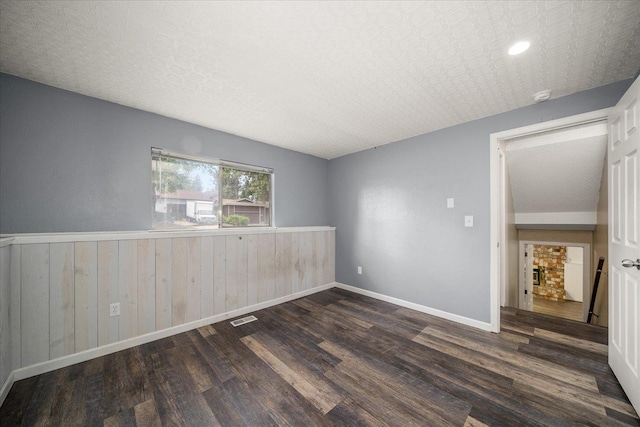 415 E Shiloh Hills Dr, Spokane, WA 99208 - spare room featuring wood finished floors, wainscoting, a smoke detector, wooden walls, and recessed lighting
