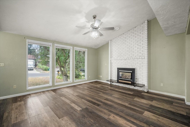415 E Shiloh Hills Dr, Spokane, WA 99208 - unfurnished living room featuring ceiling fan, vaulted ceiling, wood finished floors, and a fireplace