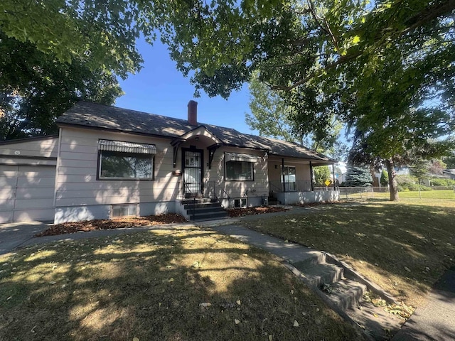 5504 N Post St, Spokane, WA 99205 - bungalow-style home with a chimney and a garage