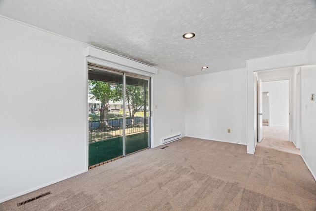 5504 N Post St, Spokane, WA 99205 - empty room featuring a baseboard heating unit, a textured ceiling, carpet flooring, and recessed lighting