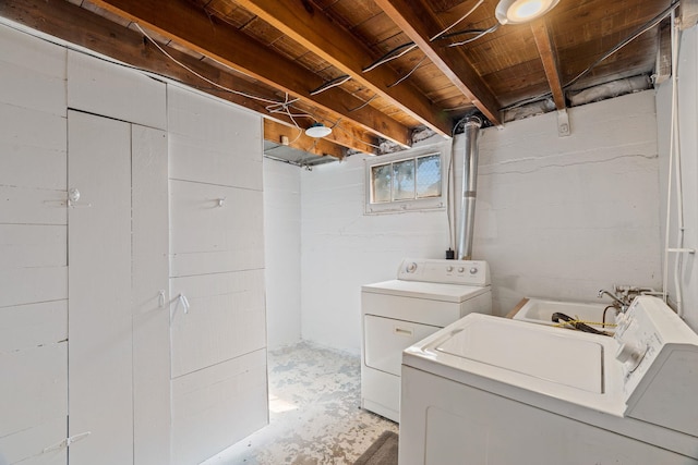 5504 N Post St, Spokane, WA 99205 - washroom featuring washer and clothes dryer and concrete block wall