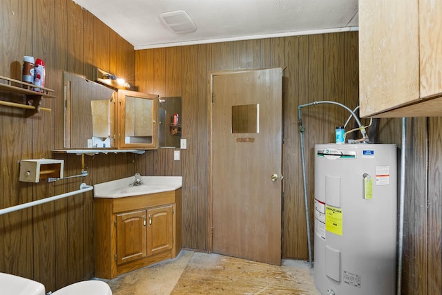 2510 N Rambo Rd, Spokane, WA 99224 - bathroom with electric water heater, vanity, and wooden walls