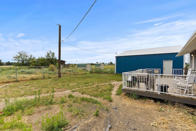 2510 N Rambo Rd, Spokane, WA 99224 - view of yard featuring a wooden deck, a pole building, and an outbuilding