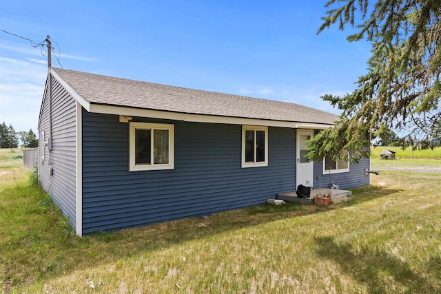 2510 N Rambo Rd, Spokane, WA 99224 - view of property exterior with a lawn and a shingled roof