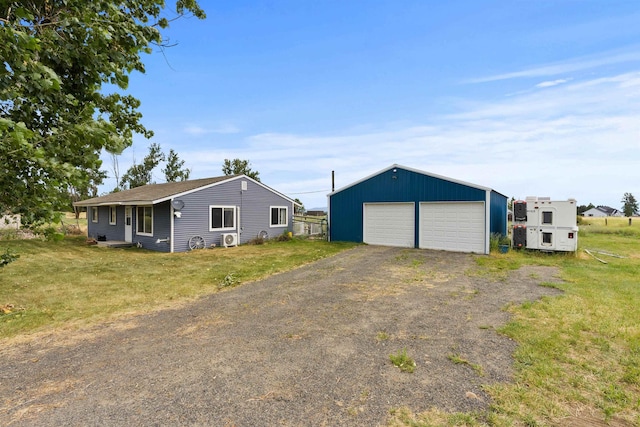 2510 N Rambo Rd, Spokane, WA 99224 - view of front of house featuring an outbuilding, a garage, and a front yard