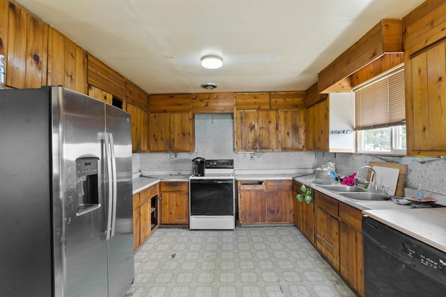 2510 N Rambo Rd, Spokane, WA 99224 - kitchen with stainless steel refrigerator with ice dispenser, white electric range, dishwasher, brown cabinets, and light countertops
