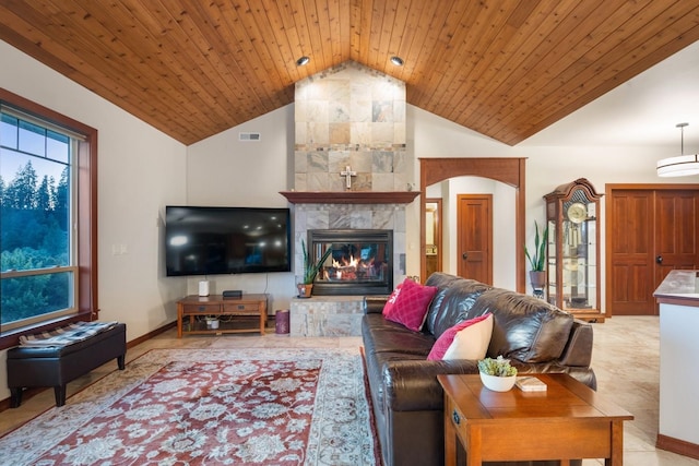 7814 S Ellis Rd, Spokane, WA 99223 - living room with vaulted ceiling, a tiled fireplace, and wooden ceiling