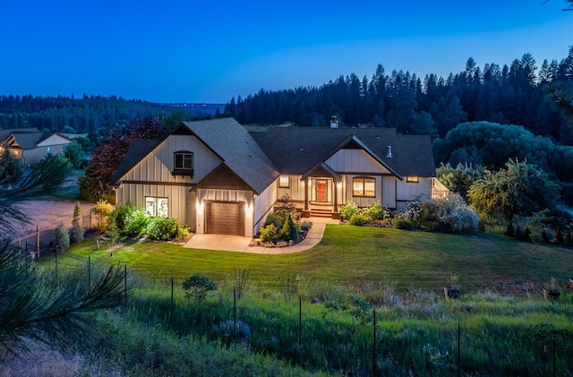 7814 S Ellis Rd, Spokane, WA 99223 - view of front of home featuring a forest view and a garage