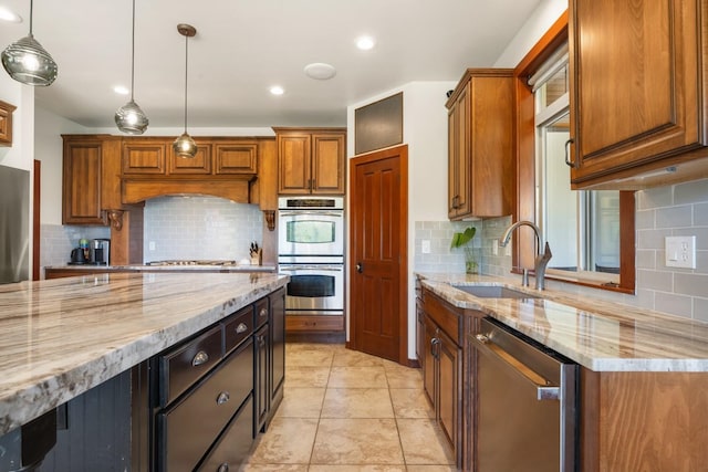 7814 S Ellis Rd, Spokane, WA 99223 - kitchen with stainless steel appliances, decorative backsplash, light stone countertops, and recessed lighting