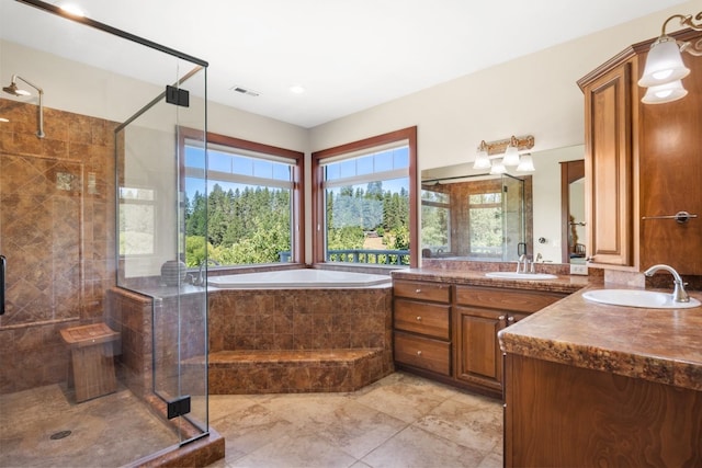 7814 S Ellis Rd, Spokane, WA 99223 - full bathroom featuring a garden tub, two vanities, and a shower stall