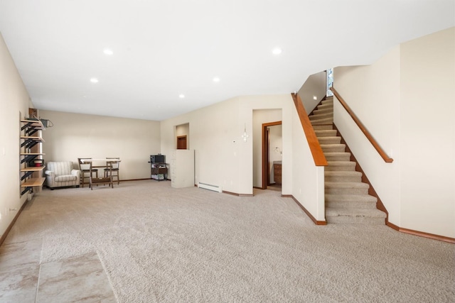 7814 S Ellis Rd, Spokane, WA 99223 - basement with baseboard heating, stairs, carpet flooring, and recessed lighting