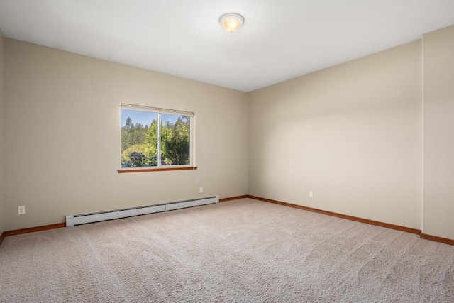 7814 S Ellis Rd, Spokane, WA 99223 - empty room featuring a baseboard heating unit and carpet flooring
