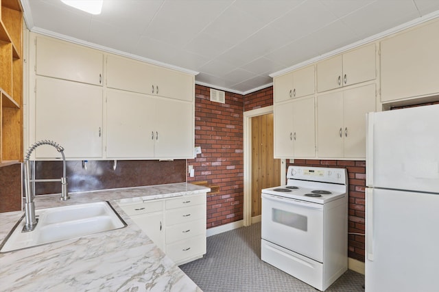 7102 E Bridgeport Ave, Spokane Valley, WA 99212 - kitchen with white appliances, cream cabinets, light countertops, brick wall, and open shelves