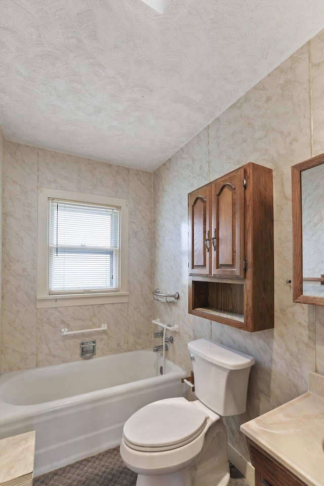 7102 E Bridgeport Ave, Spokane Valley, WA 99212 - bathroom featuring a tub to relax in, vanity, and a textured ceiling