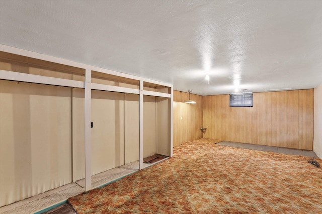 7102 E Bridgeport Ave, Spokane Valley, WA 99212 - finished basement featuring wooden walls and a textured ceiling