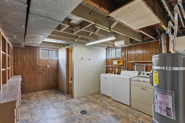 7102 E Bridgeport Ave, Spokane Valley, WA 99212 - basement featuring water heater, washer and clothes dryer, and wooden walls