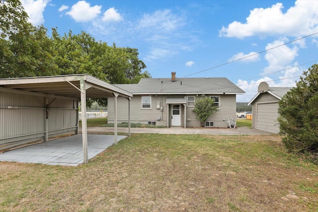 7102 E Bridgeport Ave, Spokane Valley, WA 99212 - back of property featuring a lawn, an outdoor structure, and a shingled roof