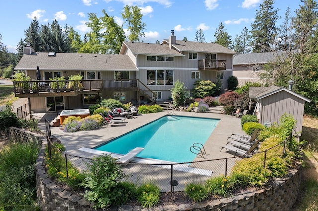 5321 Pinebrook Ct, Spokane, WA 99206 - view of pool with a hot tub, stairway, a diving board, a wooden deck, and a patio area
