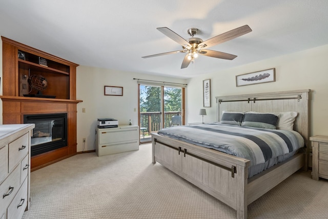 5321 Pinebrook Ct, Spokane, WA 99206 - bedroom with access to outside, a fireplace, light carpet, and ceiling fan