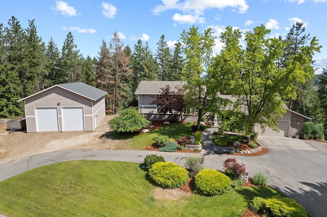 5321 Pinebrook Ct, Spokane, WA 99206 - view of front facade with an outbuilding, a detached garage, and a front yard