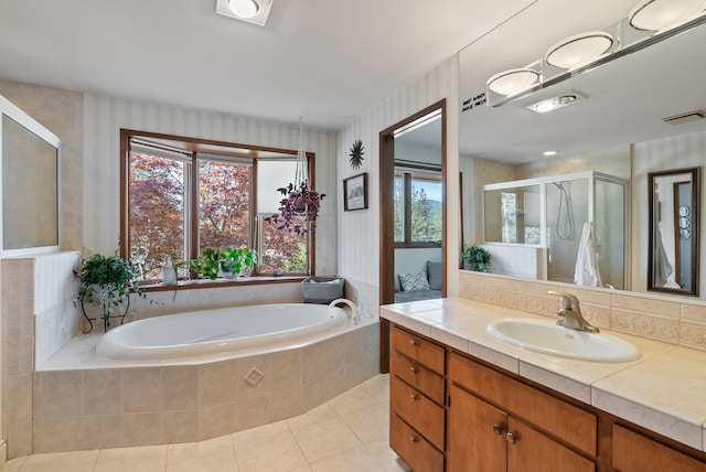 5321 Pinebrook Ct, Spokane, WA 99206 - full bathroom featuring vanity, a garden tub, tile patterned floors, a stall shower, and wallpapered walls