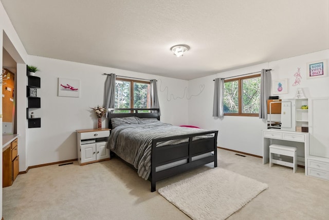 5321 Pinebrook Ct, Spokane, WA 99206 - bedroom with light colored carpet and a textured ceiling